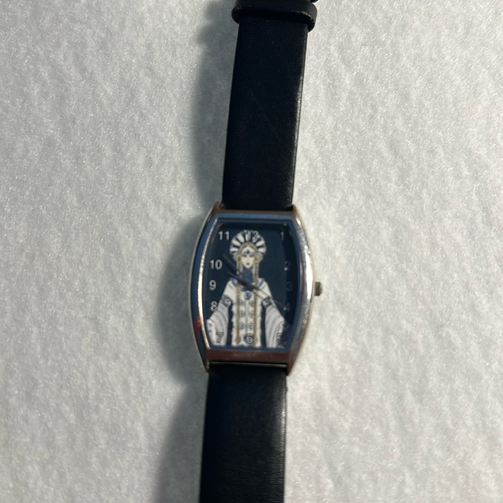Art deco Erte watch with black leather band.